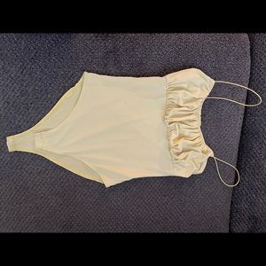 Yellow bunjee strap body suit